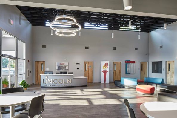 Front Lobby Lincoln Community Center Bright and welcoming lobby of Lincoln Community Center with contemporary design elements and comfortable seating areas, structurally engineered by Pinnacle Engineering