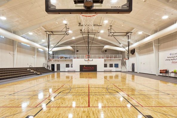 Lincoln Community Center Basketball Court Spacious and well-lit basketball court inside Lincoln Community Center, featuring high-quality flooring and modern facilities, engineered by Pinnacle Engineering