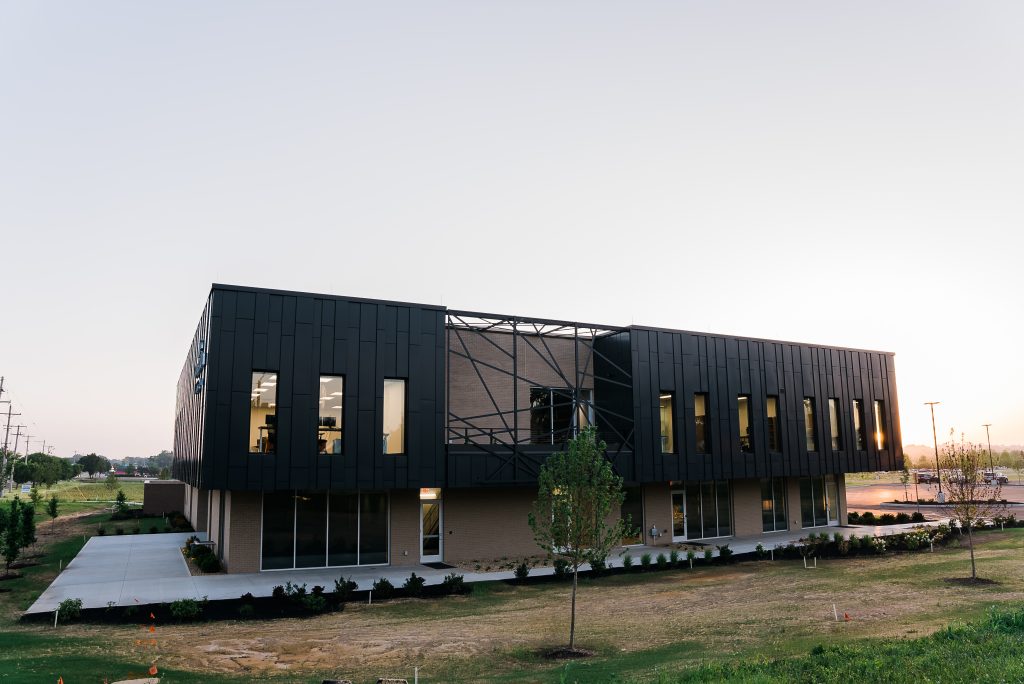 Life Connection Exterior view of the Life Connection of Ohio building designed by Pinnacle Engineering, showcasing the back side with a modern black facade, large windows, and landscaped surroundings.
