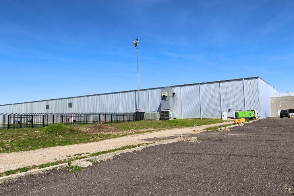 Spooky Hollow Hamilton OH Back View Steel Add On Rear view of the Spooky Nook Hamilton facility showing the metal-clad addition with utility access and a fenced-in outdoor space.